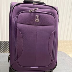 Travelpro Tourlite 21" Expandable Carry-on Spinner Purple